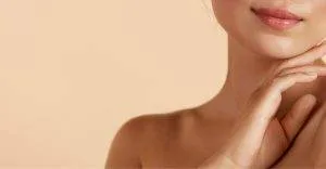 Closeup Of A Young Woman Touching Her Chin
